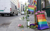 Flowers are left at the scene of a shooting in central Oslo, June 25, 2022. (Hakon Mosvold Larsen/NTB Scanpix via AP)