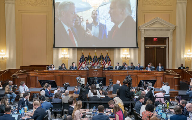 An image of former US president Donald Trump talking to his Chief of Staff Mark Meadows is seen as Cassidy Hutchinson, former aide to Trump White House chief of staff Mark Meadows, testifies as the House select committee investigating the January 6 attack on the US Capitol holds a hearing at the Capitol in Washington, Tuesday, June 28, 2022. (Sean Thew/Pool via AP)