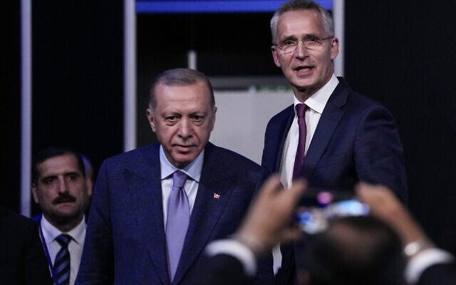 Turkish President Recep Tayyip Erdogan, second left, and NATO Secretary General Jens Stoltenberg before signing a memorandum in which Turkey agrees to Finland and Sweden's membership of the defense alliance in Madrid, Spain on Tuesday, June 28, 2022. (AP/Bernat Armangue)