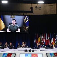 Ukraine's President Volodymyr Zelensky addresses leaders via a video screen during a round table meeting at a NATO summit in Madrid, Spain, June 29, 2022. (Manu Fernandez/AP)
