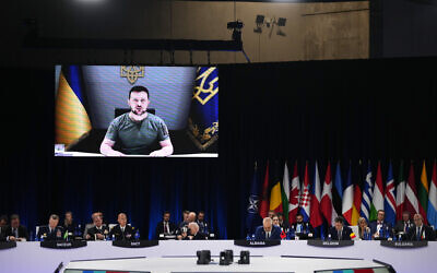 Ukraine's President Volodymyr Zelensky addresses leaders via a video screen during a round table meeting at a NATO summit in Madrid, Spain, June 29, 2022. (Manu Fernandez/AP)