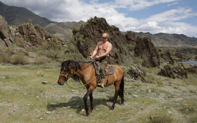 Then-Russian Prime Minister Vladimir Putin rides a horse while traveling in the mountains of the Siberian Tyva region (also referred to as Tuva), Russia, Aug. 3, 2009. (Alexei Druzhinin/Pool Photo via AP, file)