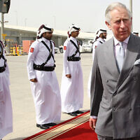 Britain's Prince Charles, center, arrives at the Hamad Airport in Doha, Qatar, February 12, 2015. (AP Photo/Osama Faisal)