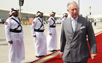 Britain's Prince Charles, center, arrives at the Hamad Airport in Doha, Qatar, February 12, 2015. (AP Photo/Osama Faisal)