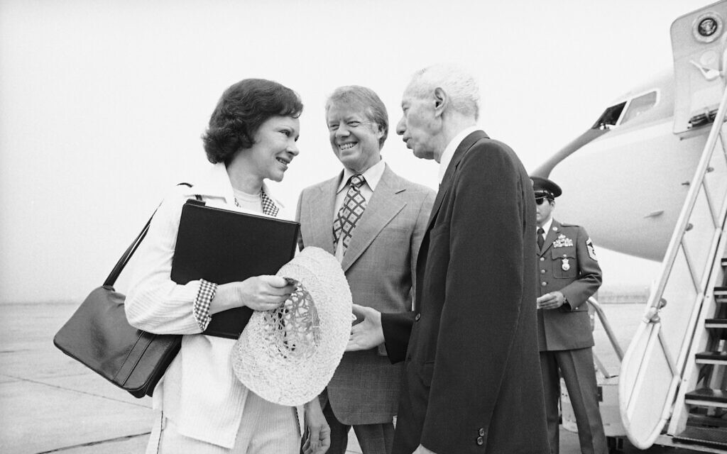 Admiral Hyman Rickover, right, greets then-US president Jimmy Carter and first lady Rosalynn Carter at the Brunswick, Georgia, airport, May 27, 1977 as they depart for Port Canaveral, Florida, to tour and ride in the USS Los Angeles submarine. (AP Photo/Charles Harrity)