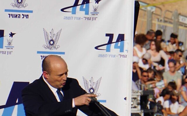 Prime Minister Naftali Bennett speaks at the IAF pilots course graduation ceremony on June 23, 2022. (Emanuel Fabian/Times of Israel)