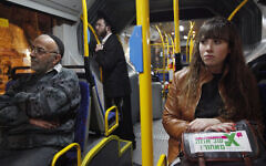 Illustrative: Secular Israelis board  a gender-segregated bus where women sit in the back of the bus, and men in the front. The secular women sat among ultra orthodox Jewish men in the front, as part of a protest against the exclusion of women in the public sphere, January 1, 2012. (Miriam Alster / Flash90)