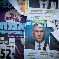 Illustrative: Campaign posters prior to general elections, in Tel Aviv, on March 17, 2021. (Miriam Alster/FLASH90)
