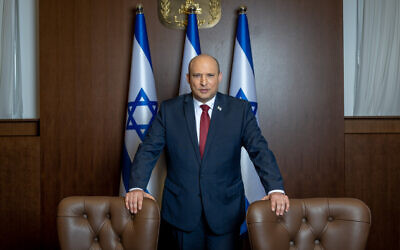 Prime Minister Naftali Bennett poses for a picture at the Prime Minister's Office in Jerusalem, January 26, 2022. (Yonatan Sindel/Flash90)