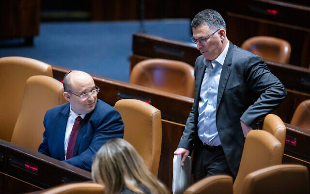 Israeli Prime Minister Naftali Bennett and Minister of Justice Gideon Saar at the assembly hall of the Knesset,  on May 11, 2022. (Olivier Fitoussi/Flash90)