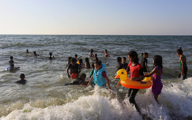 Palestinians at the beach in Rafah, in the Southern Gaza Strip on June 3, 2022. (Abed Rahim Khatib/Flash90)