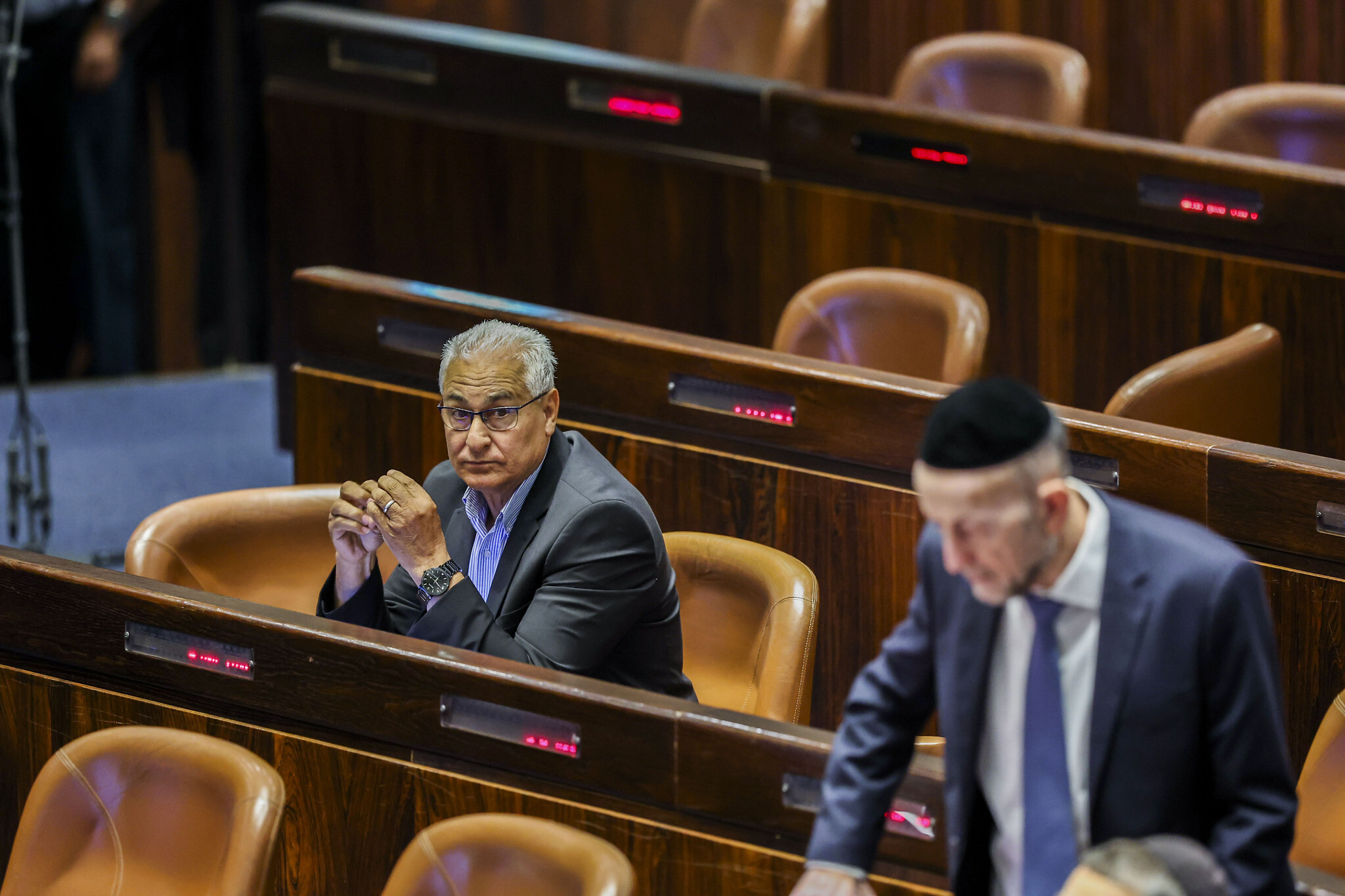 Ra’am MK Mazen Ghanaim (left) attends a vote on a West Bank bill at the Knesset, in Jerusalem on June 6, 2022. (Yonatan Sindel/Flash90)