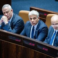 (R-L) Prime Minister Naftali Bennett, Foreign Affairs Yair Lapid and Defense Minister Benny Gantz seen during a discussion and a vote on the "West Bank bill" at the Knesset on June 6, 2022. (Yonatan Sindel/Flash90)