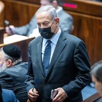Opposition leader Benjamin Netanyahu in the Knesset plenum during a vote on the so-called settler law, June 6, 2022. (Yonatan Sindel/Flash90)