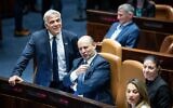 Israeli prime minister Naftali Bennett with Minister of Foreign Affairs Yair Lapid during a discussion and a vote on the vote on the settlement bill at the Knesset, the Israeli parliament in Jerusalem on June 6, 2022 (Yonatan Sindel/Flash90)