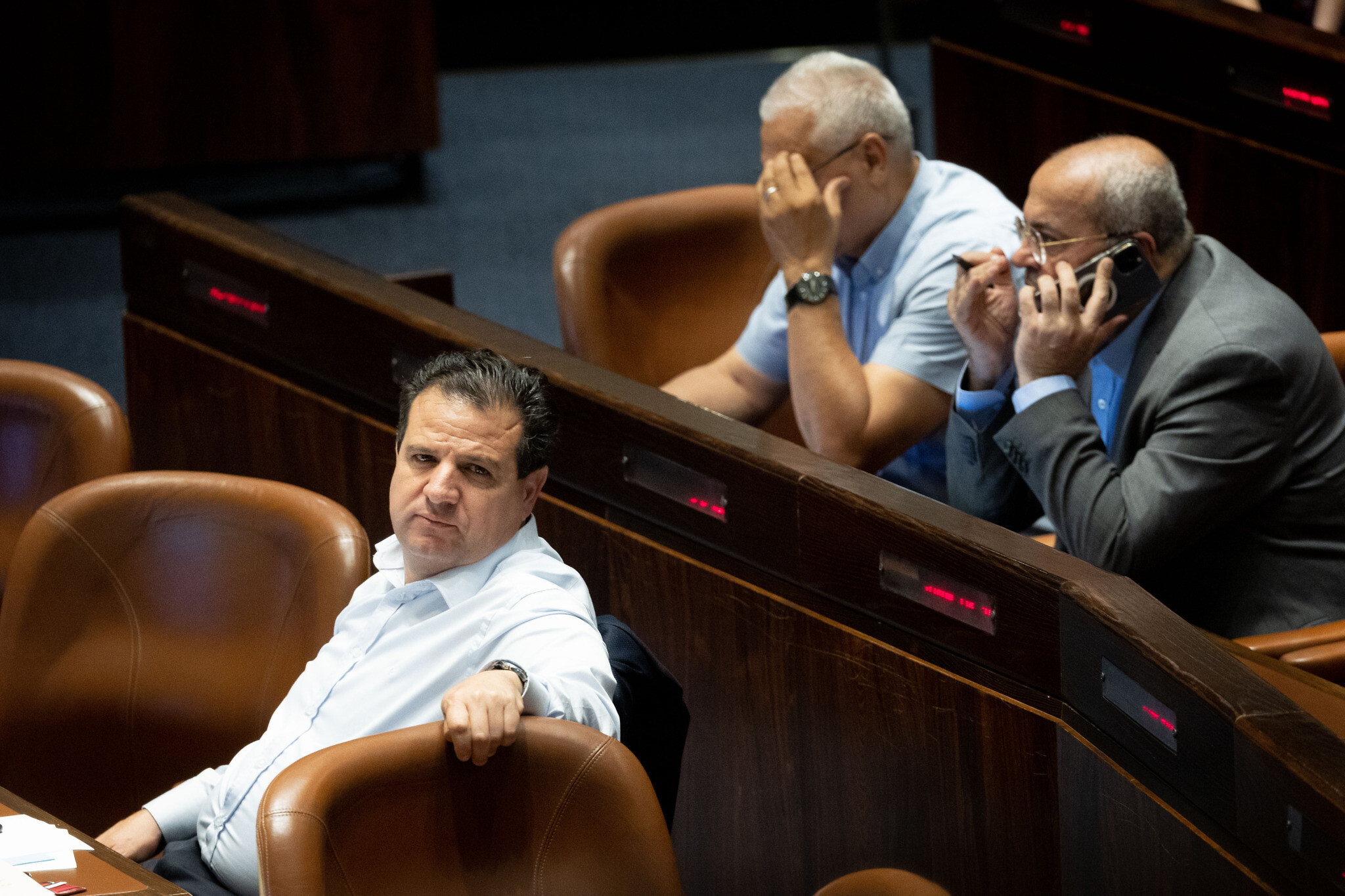 MK Ayman Odeh, left, seen during a plenum session at the Knesset, in Jerusalem on June 8, 2022. (Yonatan Sindel/Flash90)