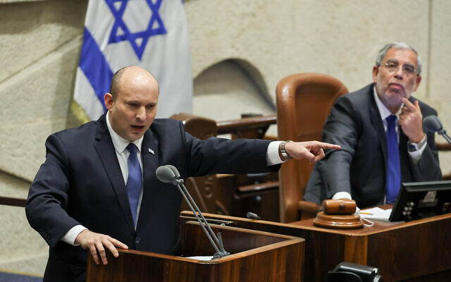 Prime Minister Naftali Bennett addresses the Knesset during a "40 signatures debate" in the plenum hall on June 13, 2022. (Yonatan Sindel/Flash90