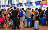 Travelers at Ben Gurion International Airport, on June 14, 2022. (Avshalom Sassoni/Flash90)