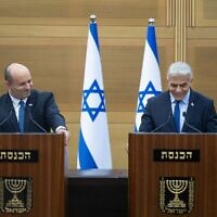 Prime Minister Naftali Bennett and Foreign Minister Yair Lapid announce the collapse of their coalition, at a joint appearance at the Knesset, June 20, 2022. (Yonatan Sindel/Flash90)