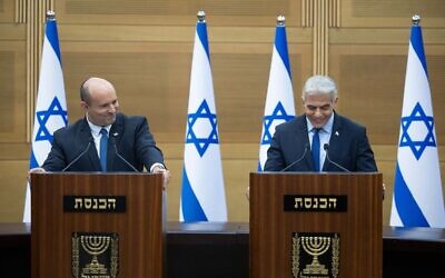 Prime Minister Naftali Bennett and Foreign Minister Yair Lapid announce the collapse of their coalition, at a joint appearance at the Knesset, June 20, 2022. (Yonatan Sindel/Flash90)