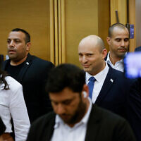 Outgoing Prime Minister Naftali Bennett pictured at a press conference at which he announced he will not be running in the next elections. At left is Ayelet Shaked, the new Yamina party leader. June 29, 2022. (Olivier Fitoussi/Flash90)