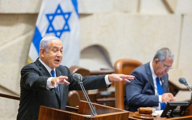 Opposition leader MK Benjamin Netanyahu speaks in the Knesset as Knesset Speaker MK Mickey Levy sits in background, at the Knesset in Jerusalem, on June 30, 2022. (Olivier Fitoussi/Flash90)