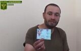 Vladimir Kozlovsky displays his Israeli ID card in a video apparently taken after he was taken captive by pro-Russian forces in Luhansk after fighting for the Ukrainian army, June 30, 2022. (Screenshot/Twitter)