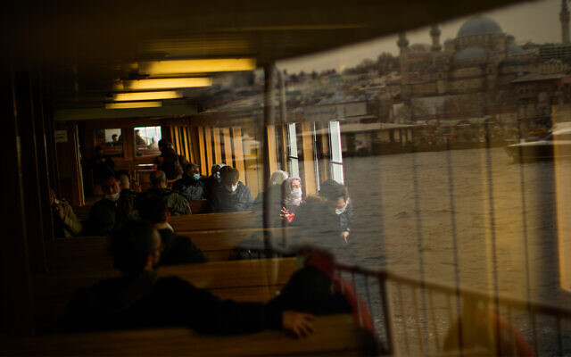 Illustrative: Commuters take a ride in a ferry crossing the Bosphorus strait in Istanbul, Turkey in April 2022. (AP Photo/Francisco Seco)