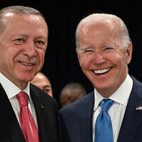 Turkey's President Recep Tayyip Erdogan (L) and US President Joe Biden shake hands at the start of the first plenary session of the NATO summit at the Ifema congress centre in Madrid, on June 29, 2022. (Gabriel Bouys/AFP)
