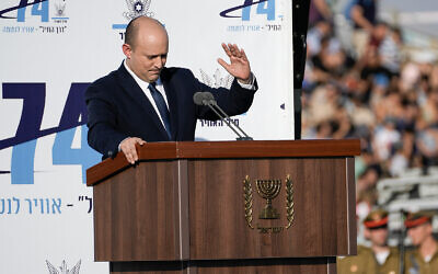 Prime Minister Naftali Bennett attends a graduation ceremony for new pilots at Hatzerim air force base near the southern city of Beersheba, June 23, 2022. (AP/Tsafrir Abayov)