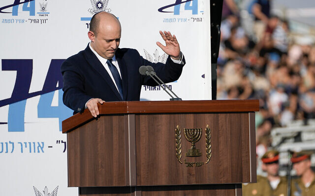 Prime Minister Naftali Bennett attends a graduation ceremony for new pilots at Hatzerim air force base near the southern city of Beersheba, June 23, 2022. (AP Photo/Tsafrir Abayov)