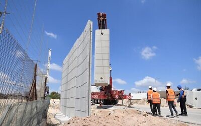 Construction work begins to upgrade a section of the West Bank security barrier, June 21, 2022. (Defense Ministry)