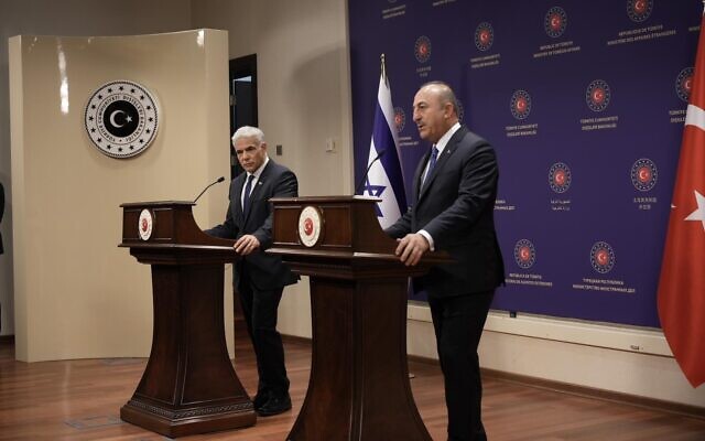 Foreign Minister Yair Lapid (left) speaks alongside his Turkish counterpart, Mevlut Cavusoglu, in Ankara on June 23, 2022. (Boaz Oppenheim/GPO)