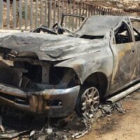A burnt out car is seen near the West Bank village of Mughayir, after an alleged assualt by Israeli settlers, June 25, 2022. (Mughayir Council via Yesh Din)