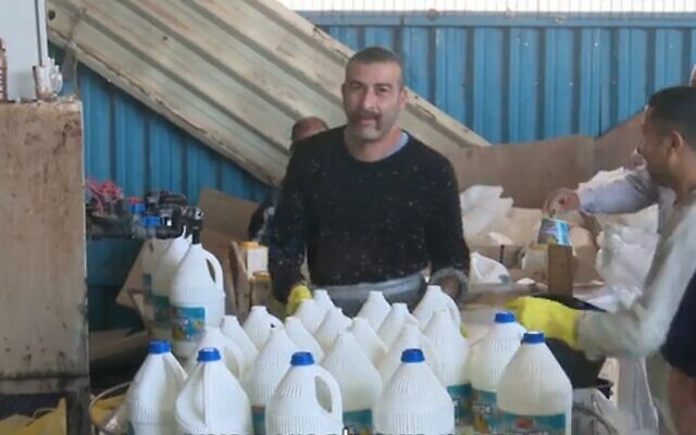 Screen capture from video of workers at the Yahalom cleaning product factory. (Channel 12 News)