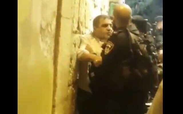 Police detain Sheikh Muhammad Hassan Salamah in Jerusalem's Old City, June 5, 2022 (video screenshot)