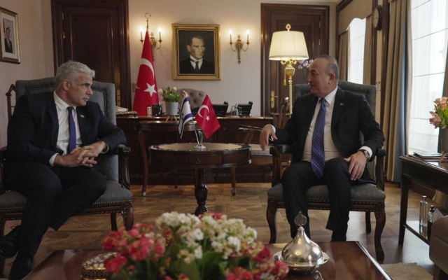 Foreign Minister Yair Lapid (right) meets with his Turkish counterpart, Mevlut Cavusoglu, in Ankara on June 23, 2022. (Boaz Oppenheim/GPO)