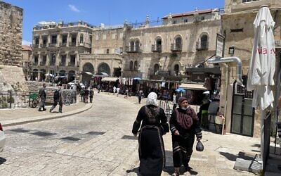 The Imperial Hotel (left) and the Petra Hostel (right), located between Jaffa Gate and the Arab market in Jerusalem's Old City, June 21, 2022. (Sue Surkes/Times of Israel)
