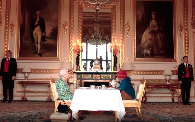 Queen Elizabeth II and Paddington Bear in a video released by the Royal Family ahead of a London concert held as part of the Platinum Jubilee celebrations, June 4, 2022. (Screen grab/BBC)