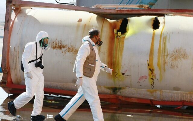 Jordanian forensics experts inspect the site of a toxic gas explosion at the Red Sea port of Aqaba on June 28, 2022. (Khalil Mazraawi/AFP)