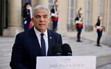 Prime Minister Yaïr Lapid makes a statement following his meeting with French president at the Elysee palace in Paris, on July 5, 2022. (Ludovic MARIN / AFP)