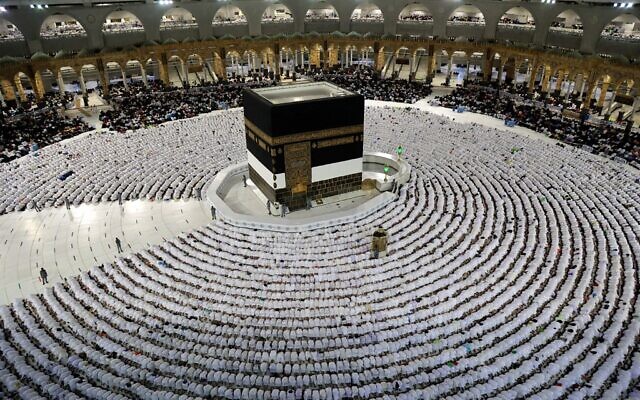 Muslim worshippers pray around the Kaaba at the Grand Mosque in Saudi Arabia's holy city of Mecca on July 5, 2022 (AFP)