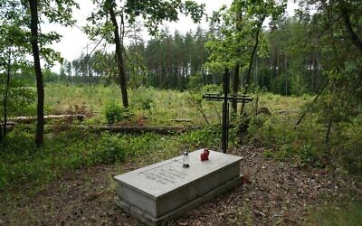 A symbolic grave in the Bialucki Forest near Ilowo on July 13, 2022 the site where the mass grave of about 8,000 Nazi victims from the nearby Soldau concentration camp in Dzialdowo was unearthed at the beginning of July 2022. (JANEK SKARZYNSKI / AFP)