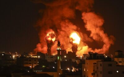 Fireballs are seen following an Israeli airstrike in response to rocket fire, Gaza City on July 16, 2022. (Mahmud Hams/AFP)