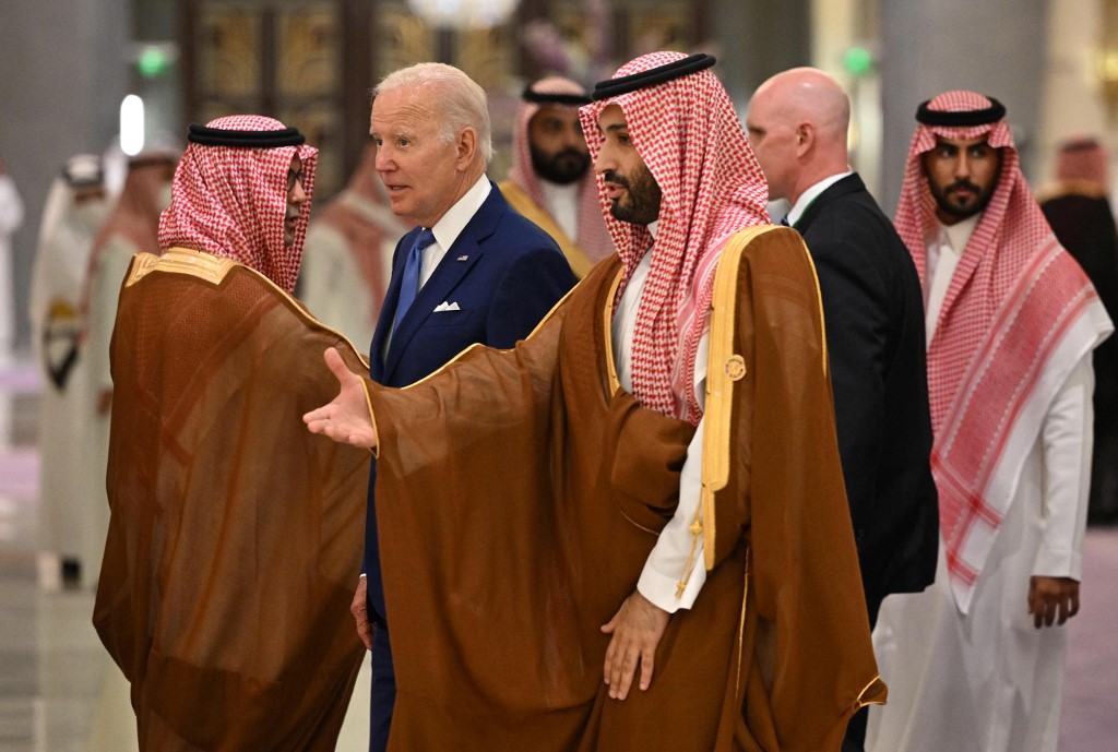 US President Joe Biden (C-L) and Saudi Crown Prince Mohammed bin Salman (C) arrive for the family photo during the Jeddah Security and Development Summit (GCC+3) at a hotel in Saudi Arabia’s Red Sea coastal city of Jeddah on July 16, 2022. (Mandel Ngan/Pool/AFP)