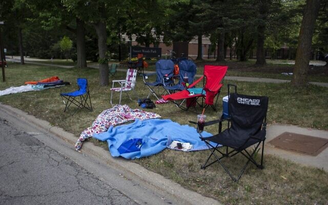 Chairs and blankets are left abandoned after a shooting at a Fourth of July parade on July 4, 2022 in Highland Park, Illinois. (Jim Vondruska/Getty Images/AFP)