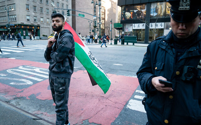 Saadah Masoud, left, a pro-Palestinian activist, shortly before beating a Jewish man on a street in New York City on April 20, 2022. (Luke Tress/Times of Israel)