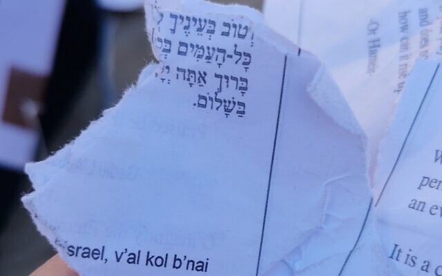 Pages torn from a siddur by young Orthodox men at the egalitarian section of the Western Wall on June 30, 2022. (Masorti Movement)