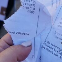 Pages torn from a siddur by young Orthodox men at the egalitarian section of the Western Wall on June 30, 2022. (Masorti Movement)