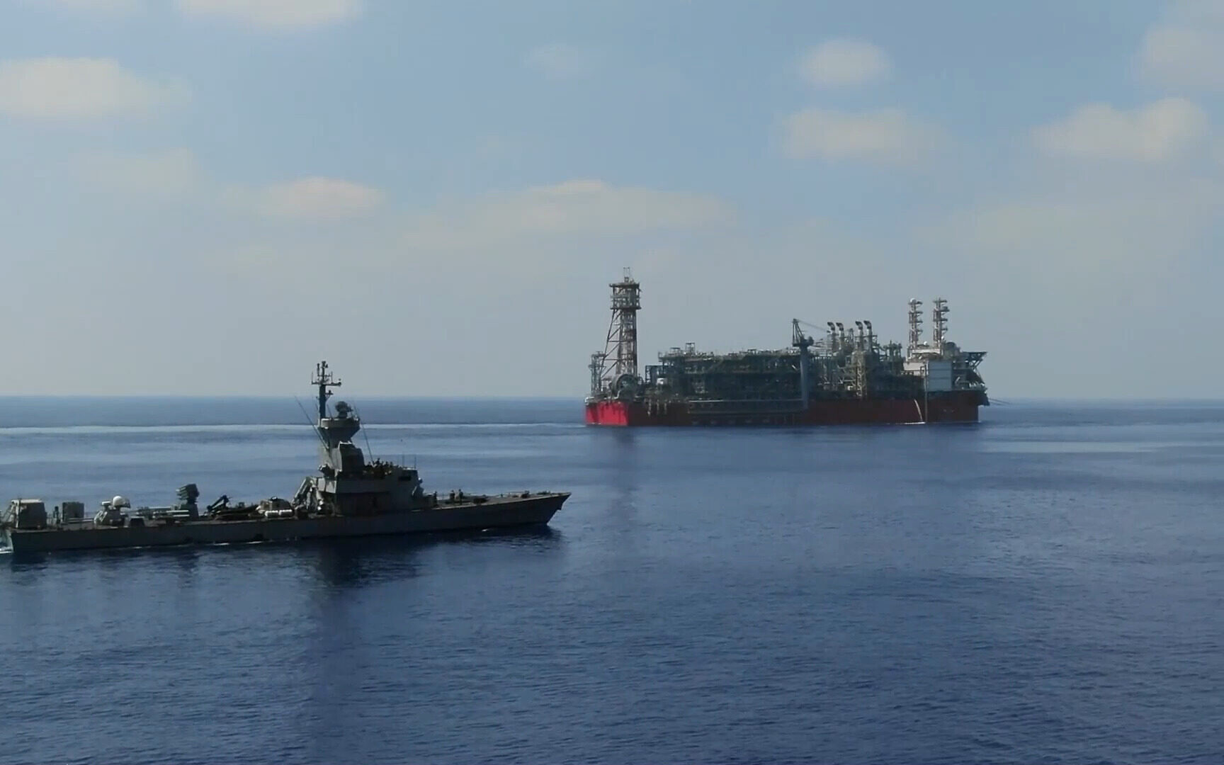 An Israeli Sa’ar Class 4.5 missile boat guards the Energean floating production, storage and offloading vessel at the Karish gas field, in footage published by the military on July 2, 2022. (Israel Defense Forces)